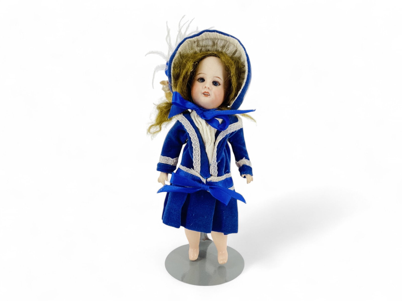 Unis France 60 bisque socket head girl.: Unis France 60 bisque socket head girl. 7 1/2" doll with mohair wig, glass sleep eyes, open mouth with teeth, jointed composition body, nicely dressed in blue velvet. Bisque has no apparent damag