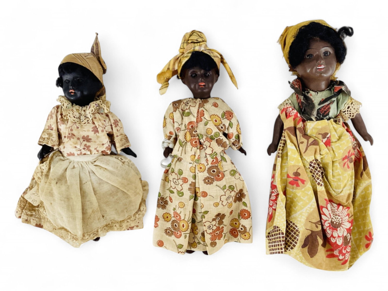 (3) Painted Bisque socket head dolls in regional costumes.: (3) Painted Bisque socket head dolls in regional costumes. Includes 7 1/2" doll marked "Germany K-1" with mohair wig, glass sleep eyes, open mouth with teeth, crude five-piece compositi