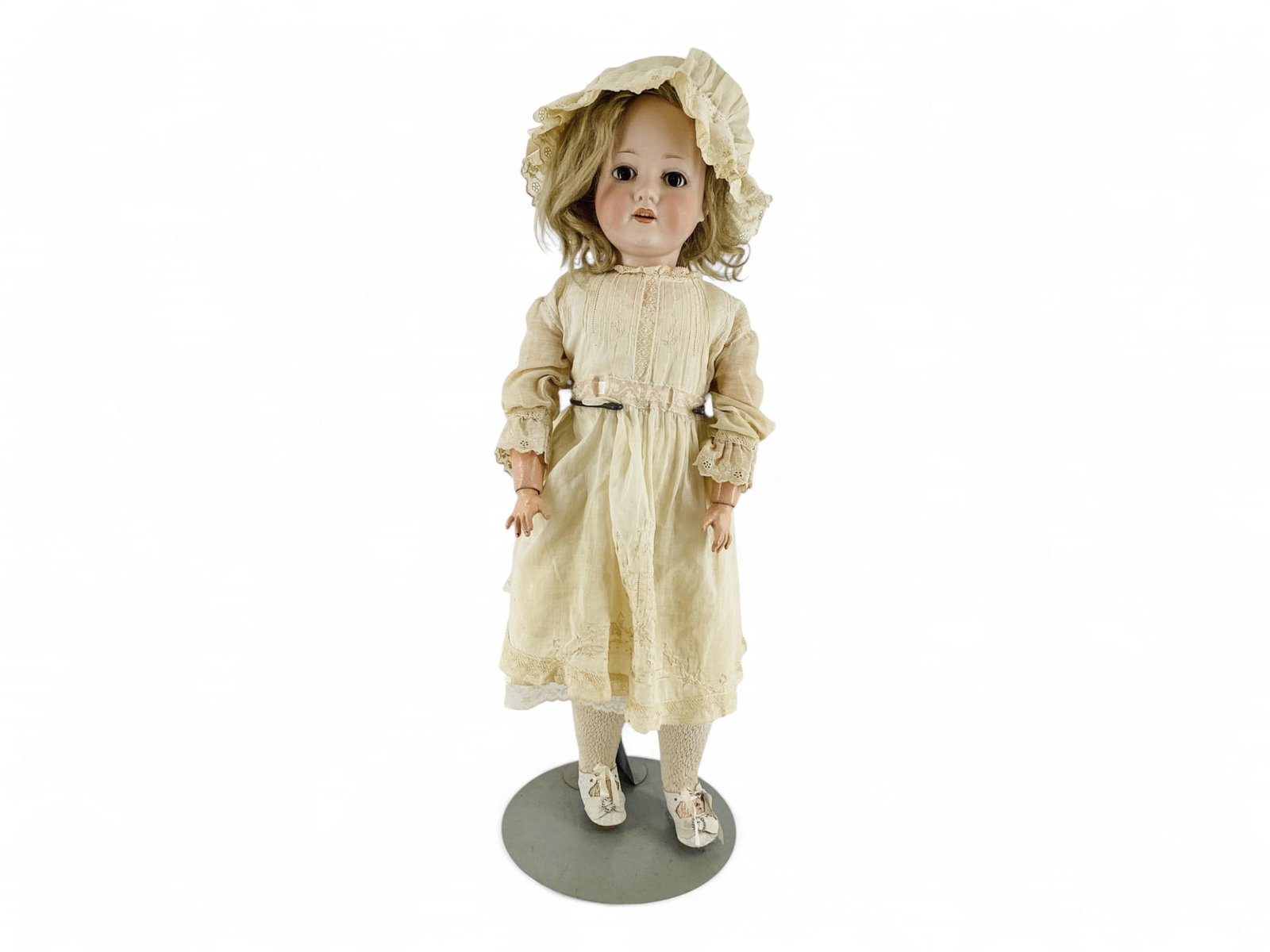 23" C. M. Bergmann Bisque Socket Head Doll: 23" C. M. Bergmann Bisque Socket Head Doll Bisque has no cracks or chips. Painted brows, open mouth with teeth, human hair wig, lashes disintegrated, eyes fixed open. String jointed socket body in goo