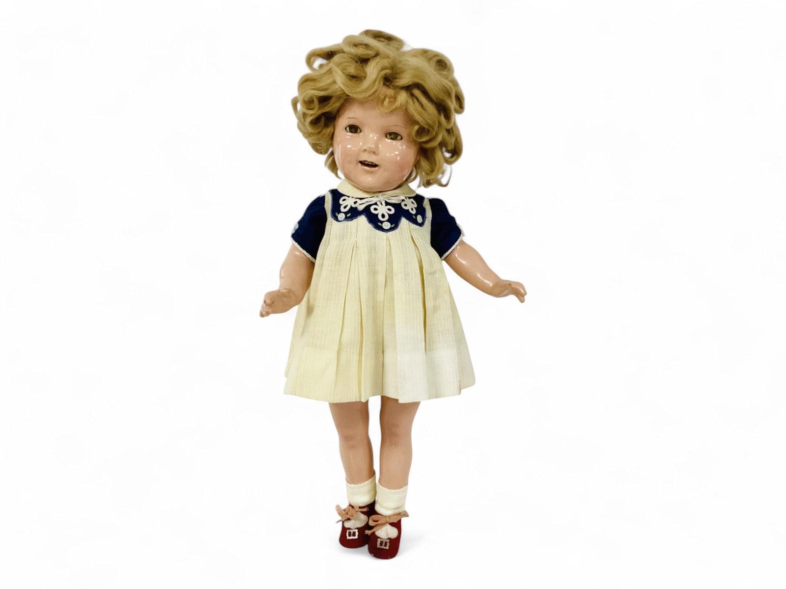 Ideal "Shirley Temple".: Ideal "Shirley Temple". 20" composition doll with mohair wig, sleep eyes, open mouth with teeth, on five-piece composition body. Shirley wears her "Our Little Girl" dress, rep