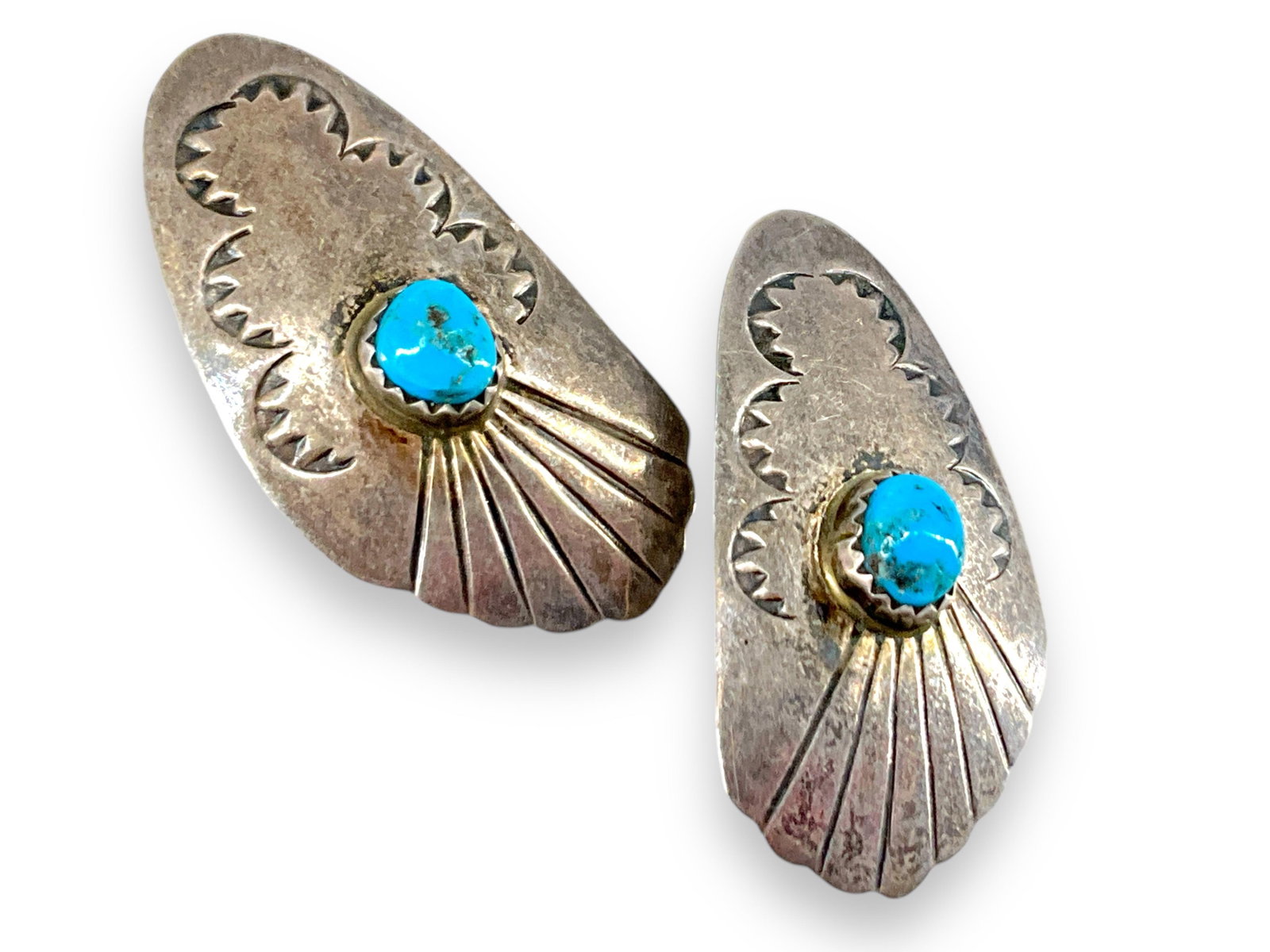 Pair of Southwestern Sterling Silver and Turquoise Stone Earrings: Pair of Southwestern Sterling Silver and Turquoise Stone Earrings Tested sterling silver/925, 0.18 troy ounces total weight, 36.25mm in length, pierced style on posts - missing backs, featuring tradit