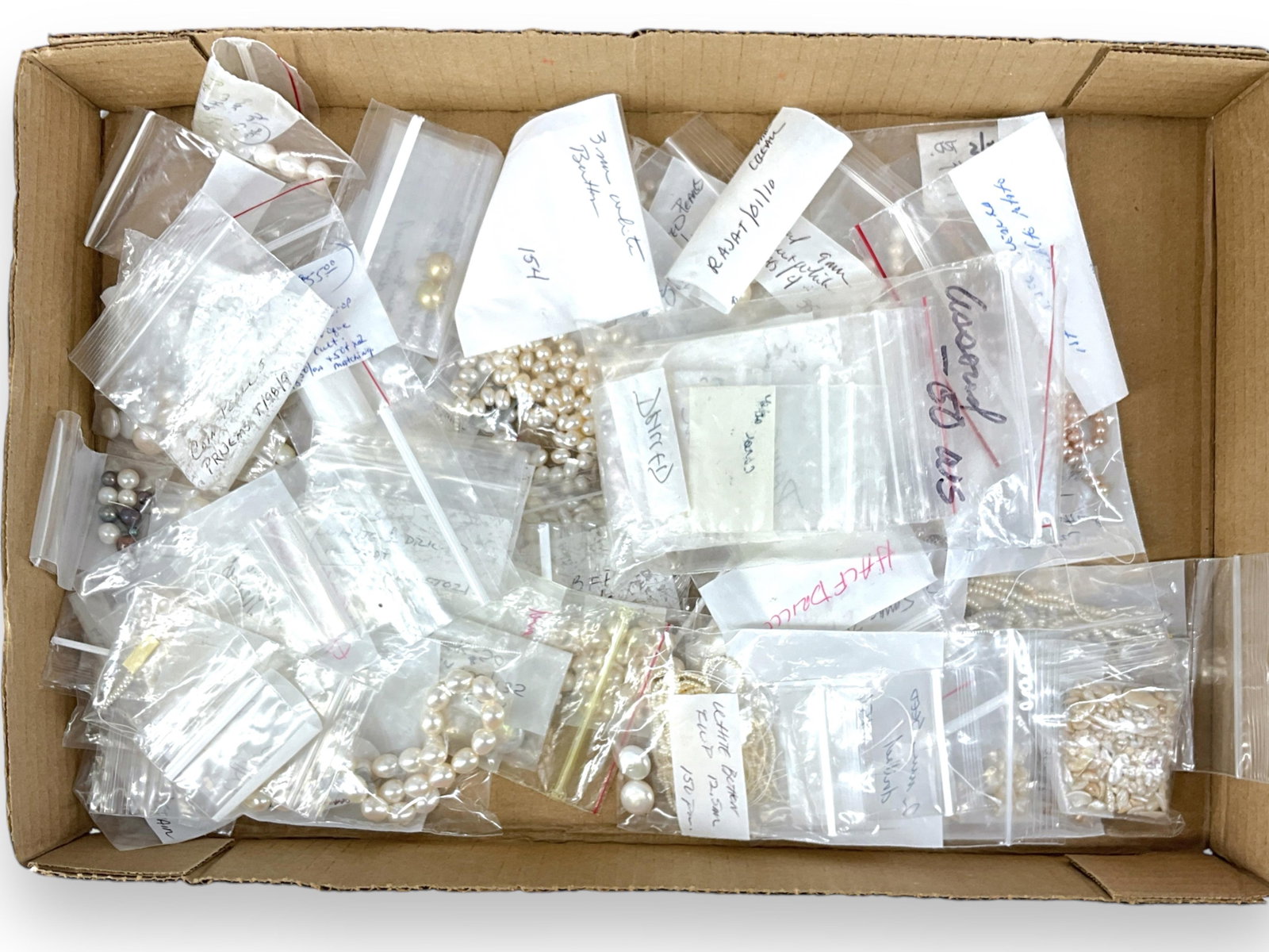Assortment of Pearls: Assortment of Pearls 1.75mm - 17.75mm in size. Seed pearls, round shapes, oval shapes, coin pearls, semi-baroque shapes and more. Includes white and off-white pearls with examples ft. lavender and cha
