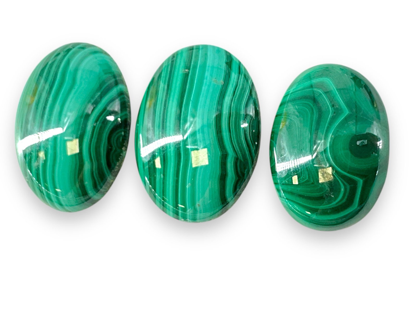 Malachite Stone Cabochons: Malachite Stone Cabochons 18mm x 13mm and 20mm x 15mm in size. Would make a nice earrings and pendant set. Oval shapes.