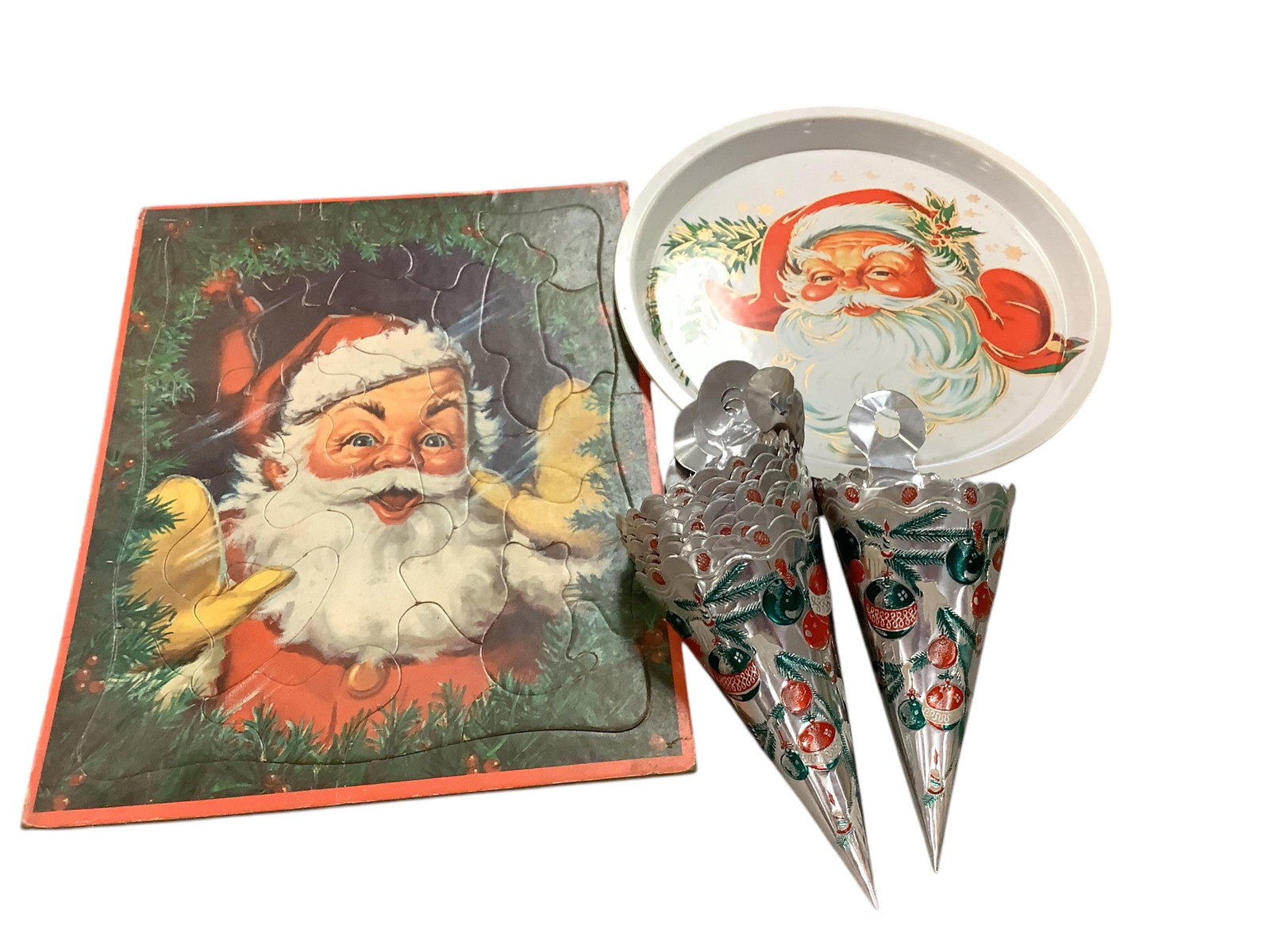 Early 1950's Christmas Items: Early 1950's Christmas Items (10) Thin aluminum candy treat cones, Jolly Santa puzzle and plastic 11" Santa serving tray.