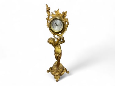 New Haven Gilt Figural Mantle Clock** 13 1/2 x 4 x 4 in. (34.3 x 10.2 x 10.2 cm.)