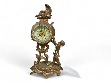 Bronze New Haven Mantle Clock w/ Figure of Child ** 9 1/2 x 5 x 2 in. (24.1 x 12.7 x 5.1 cm.)