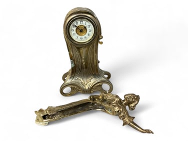 Ansonia Shelf Clock Adorned w/ Figure of Woman** 10 x 5 x 2 in. (25.4 x 12.7 x 5.1 cm.)
