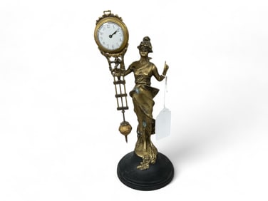 Figural Swinger Clock w/ Bronze Diana Lady Figure** 13 1/2 x 5 x 5 in. (34.3 x 12.7 x 12.7 cm.)
