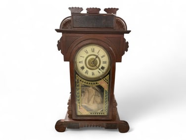 New Haven Mahogany Gingerbread Mantle Clock ** 19 1/2 x 12 1/2 x 4 in. (49.5 x 31.8 x 10.2 cm.)