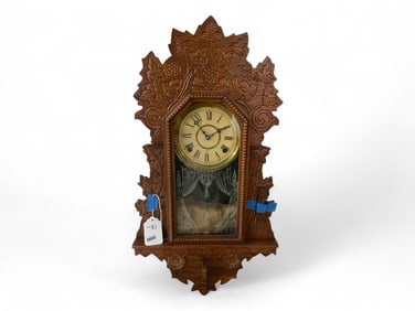 Oak Gilbert Gingerbread-Style Kitchen Clock** 27 x 14 x 4 1/2 in. (68.6 x 35.6 x 11.4 cm.)