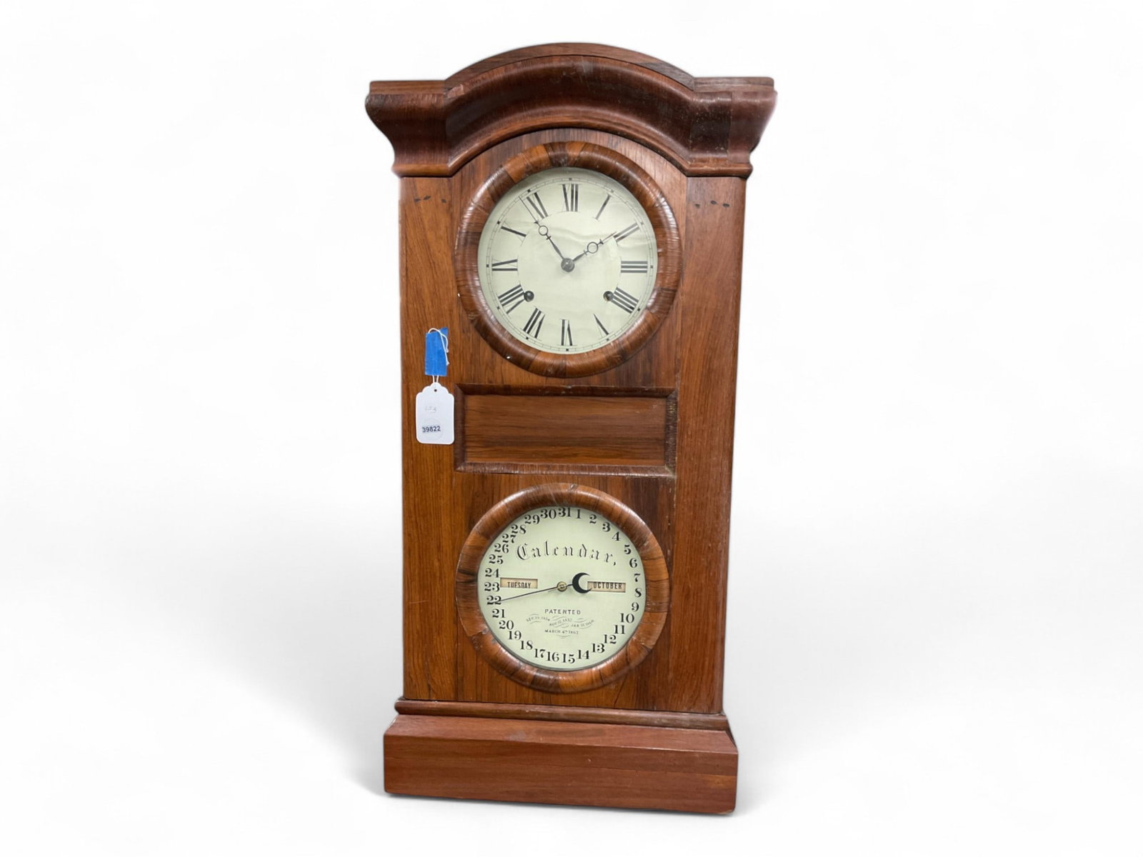 Mahogany Double Dial Calendar Clock** 33" H x 16.25" W: Mahogany Double Dial Calendar Clock** Patented March 4th, 1862. Untested. ** NO IN HOUSE SHIPPING 33" H x 16.25" W
