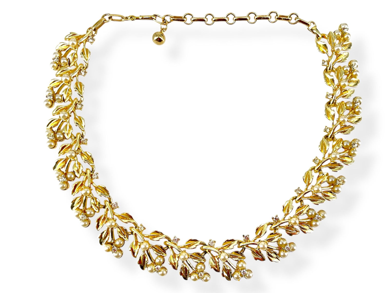 Fashion Necklace from Coro: Fashion Necklace from CoroAdjustable length, 20.0mm in width, gold tone - base metal, set with crystal rounds and faux pearls, signed Coro on the clasp, vintage - retro age. No missing crystals at the