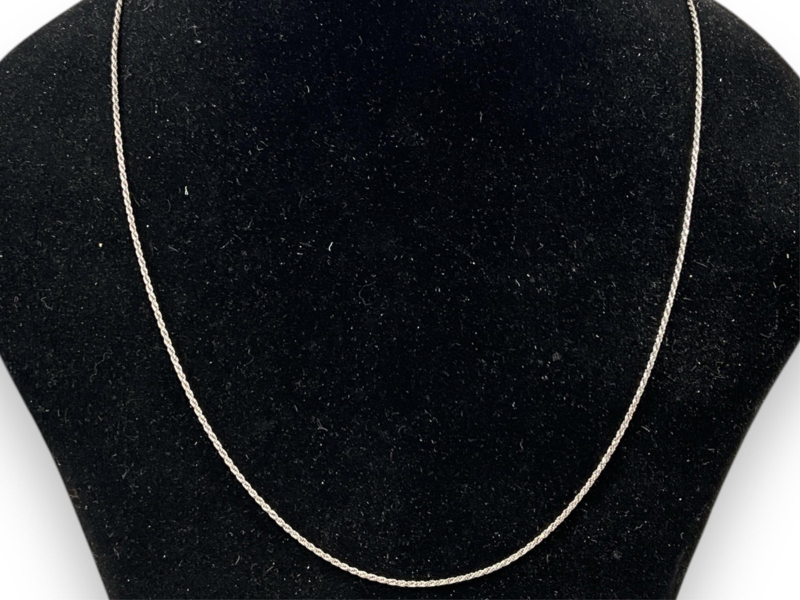 Modern Sterling Silver Spiral Chain Necklace: Modern Sterling Silver Spiral Chain Necklace 22" matinee length, 1.0mm in width, lobster hook clasp closure, adjustable length, polished metal finish, 0.10 troy ounces total weight.