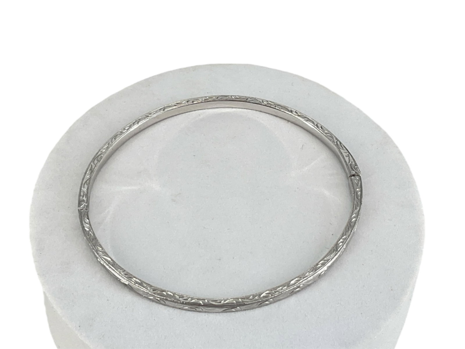 Platinum Over Sterling Bracelet: Platinum Over Sterling Bracelet Inner diameter of (2.6") and measuring (3mm wide) stamped and tested, crafted by Tacori, etched scroll pattern with mill grain edge-work, in need of a new box clasp clo
