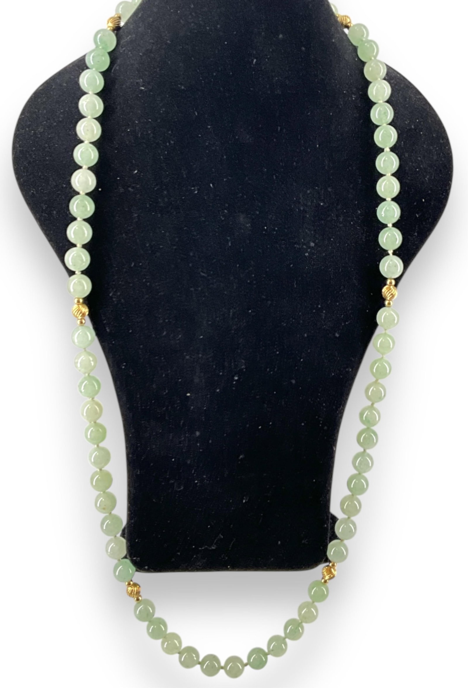 14k Beaded Stone Necklace: 14k Beaded Stone Necklace Necklace has tested 14k yellow gold ball spacers and approx 10mm polished serpentine or jade beads (speculation), necklace is approx 32" long and weighs 101.28 grams.