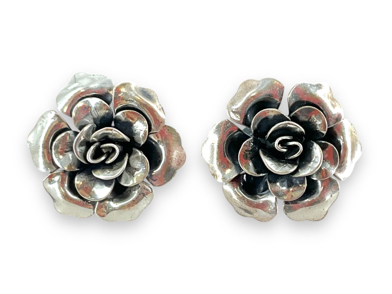 Pair of Floral Sterling Silver Earrings - From Jewel Art: Pair of Floral Sterling Silver Earrings - From Jewel Art Stamped and tested sterling silver/925, floral motif, screw-back closures (non-pierced style), approximately 0.275 troy ounces total weight, 22
