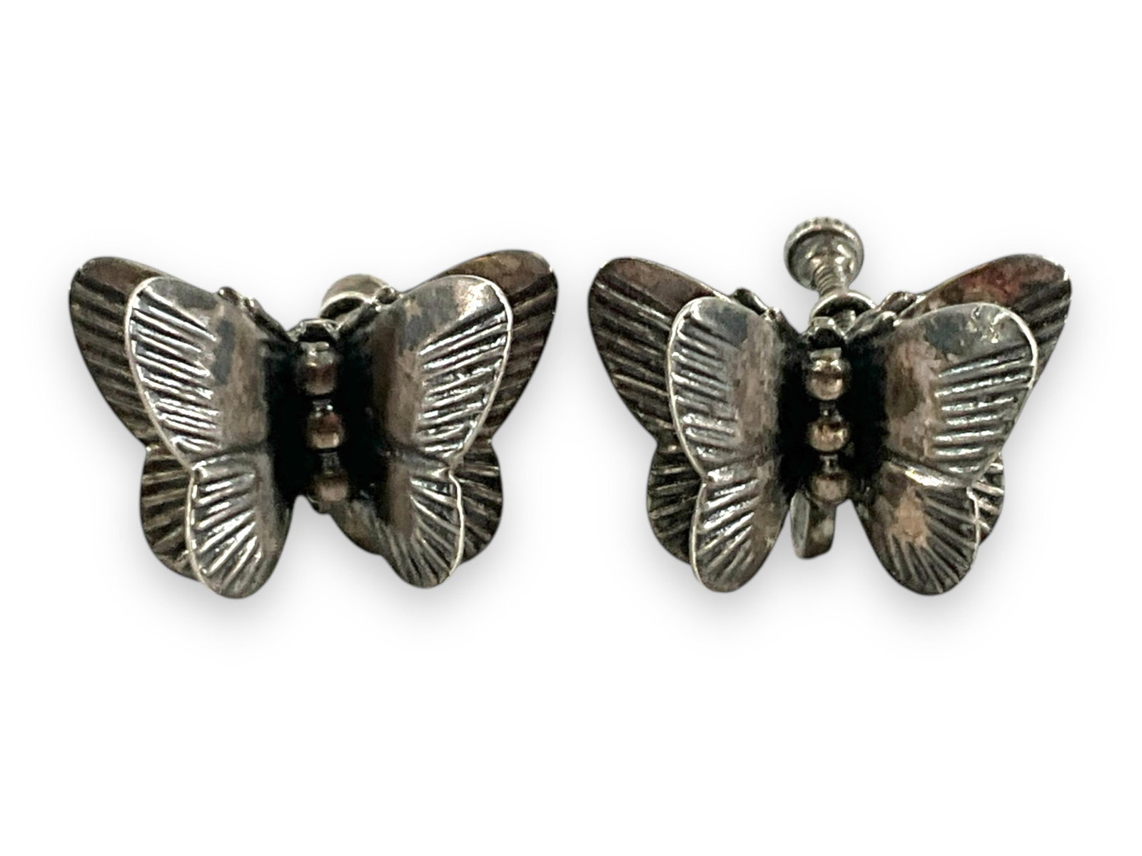 Pair of Sterling Silver Earrings - Butterflies: Pair of Sterling Silver Earrings - Butterflies Stamped and tested sterling silver/925, butterfly motif, screw-back closures (non-pierced style), approximately 0.14 troy ounces total weight, 20.75mm in