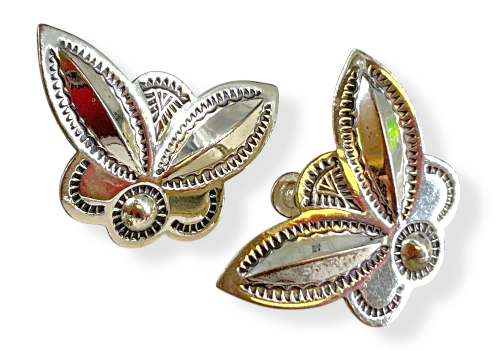 Pair of Southwestern Sterling Silver Earrings: Pair of Southwestern Sterling Silver Earrings Screw-back closures, 0.195 troy ounces total weight, semi-polished metal finish, 28.0mm in width, embossed details, stamped and tested sterling silver/925