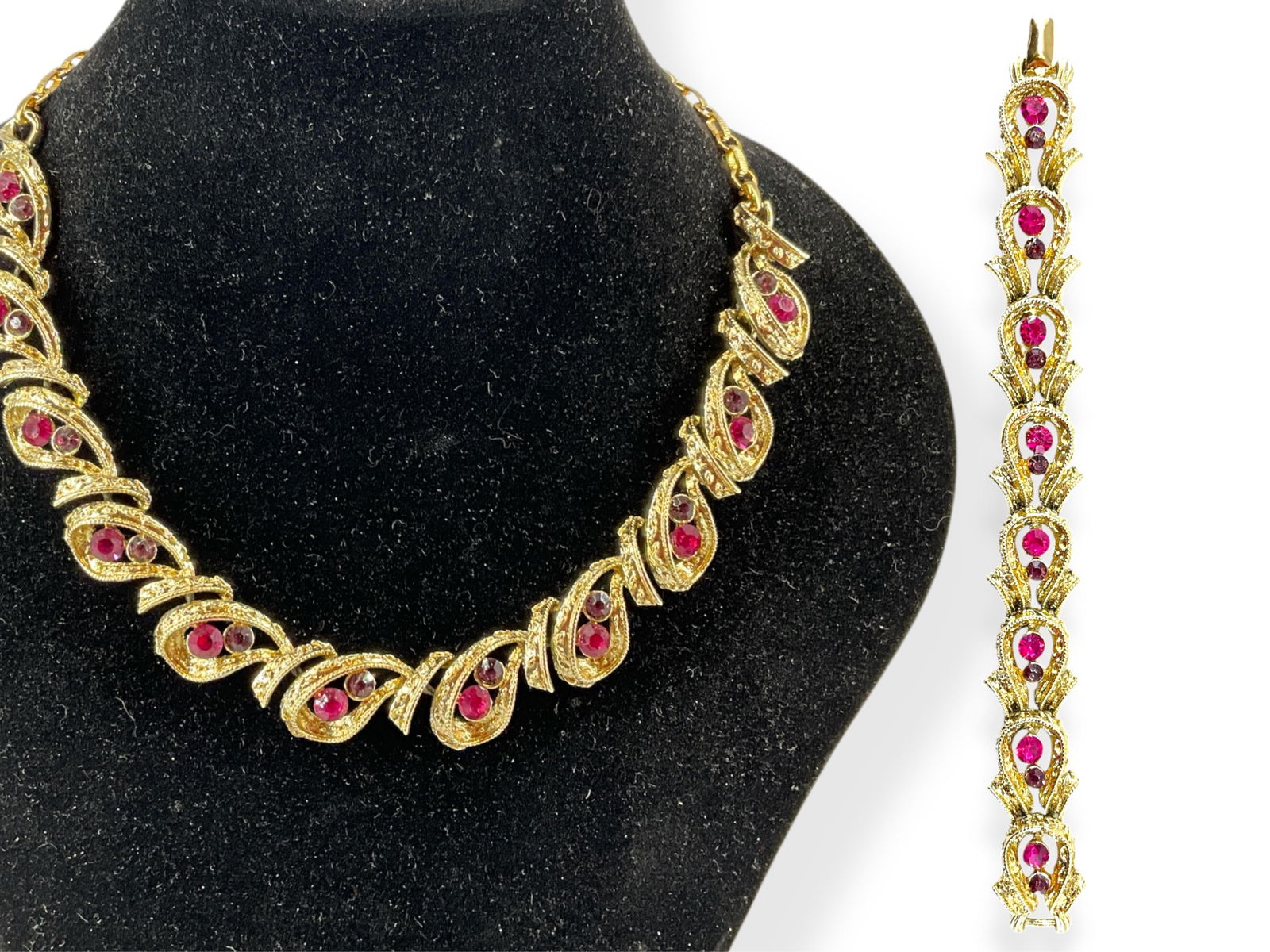 Coro Demi-Parure: Coro Demi-ParureGold tone - base metal, vintage - retro age, adjustable length necklace, 7" bracelet, set with pink and purple crystal rounds, no missing crystals at the time of listing. Signed o