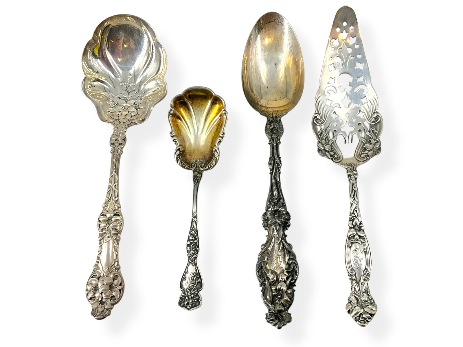 Four Pieces of Vintage Silver Serveware: Four Pieces of Vintage Silver ServewareHallmarked "Sterling" pieces include a likely dessert server which has a perforated design and is approx 8" long, has a monogram. There's also a serving spoon wh