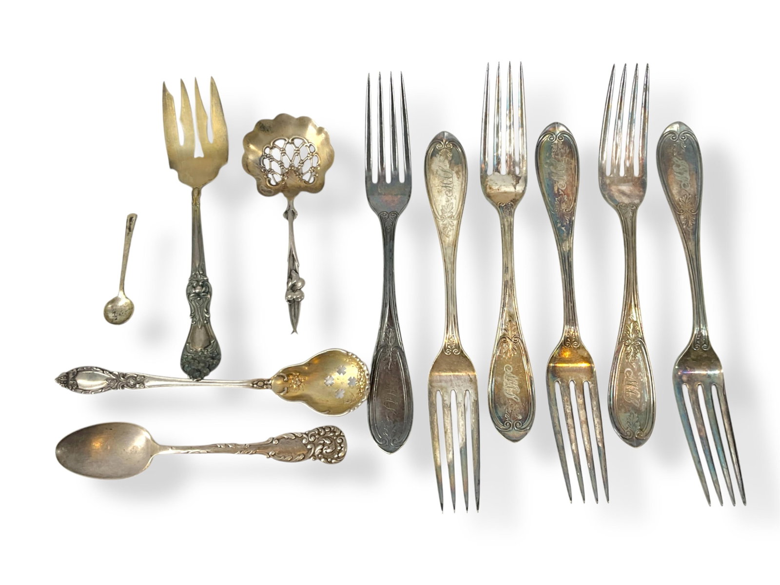 Prominent E. V. Haughwout & Co. Antique Silver Forks, Vintage Hallmarked "Sterling" Serveware: Prominent E. V. Haughwout & Co. Antique Silver Forks, Vintage Hallmarked "Sterling" ServewareSix antique forks marked "E. V. Haughwout & Co" are in this lot, and their maker was a prominent seller in