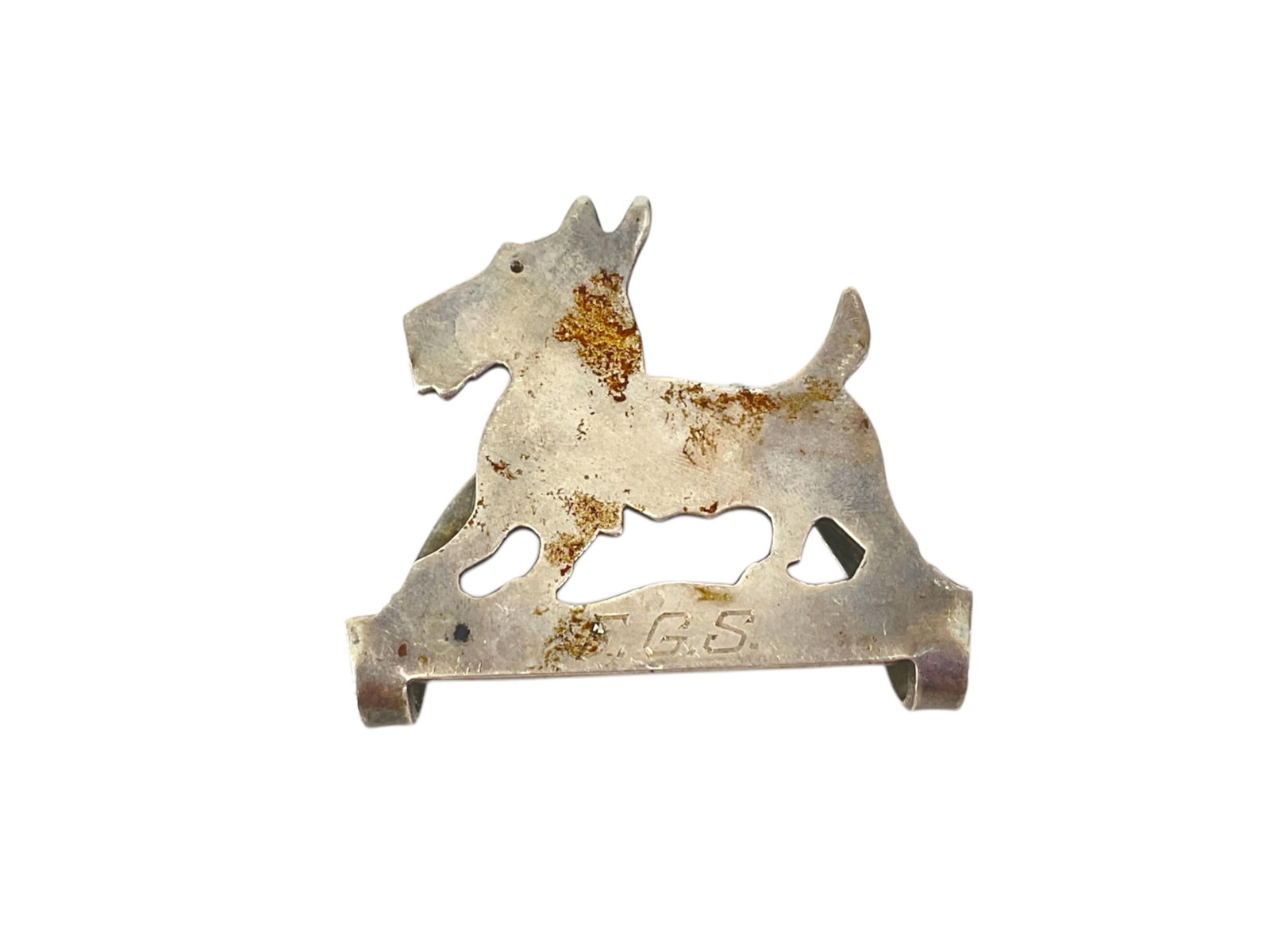 Vintage Scotty Dog Napkin Clip in Silver: Vintage Scotty Dog Napkin Clip in Silver Napkin clip is styled as a Scotty dog, is monogrammed and the reverse is hallmarked "Sterling 510" - piece is approx 1 1/2" tall and weighs 0.44 troy ounces. P