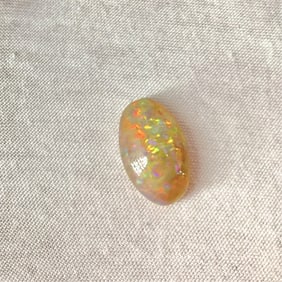 Oval-Shaped Opal Cabochon w/Red & Green Pinfire
