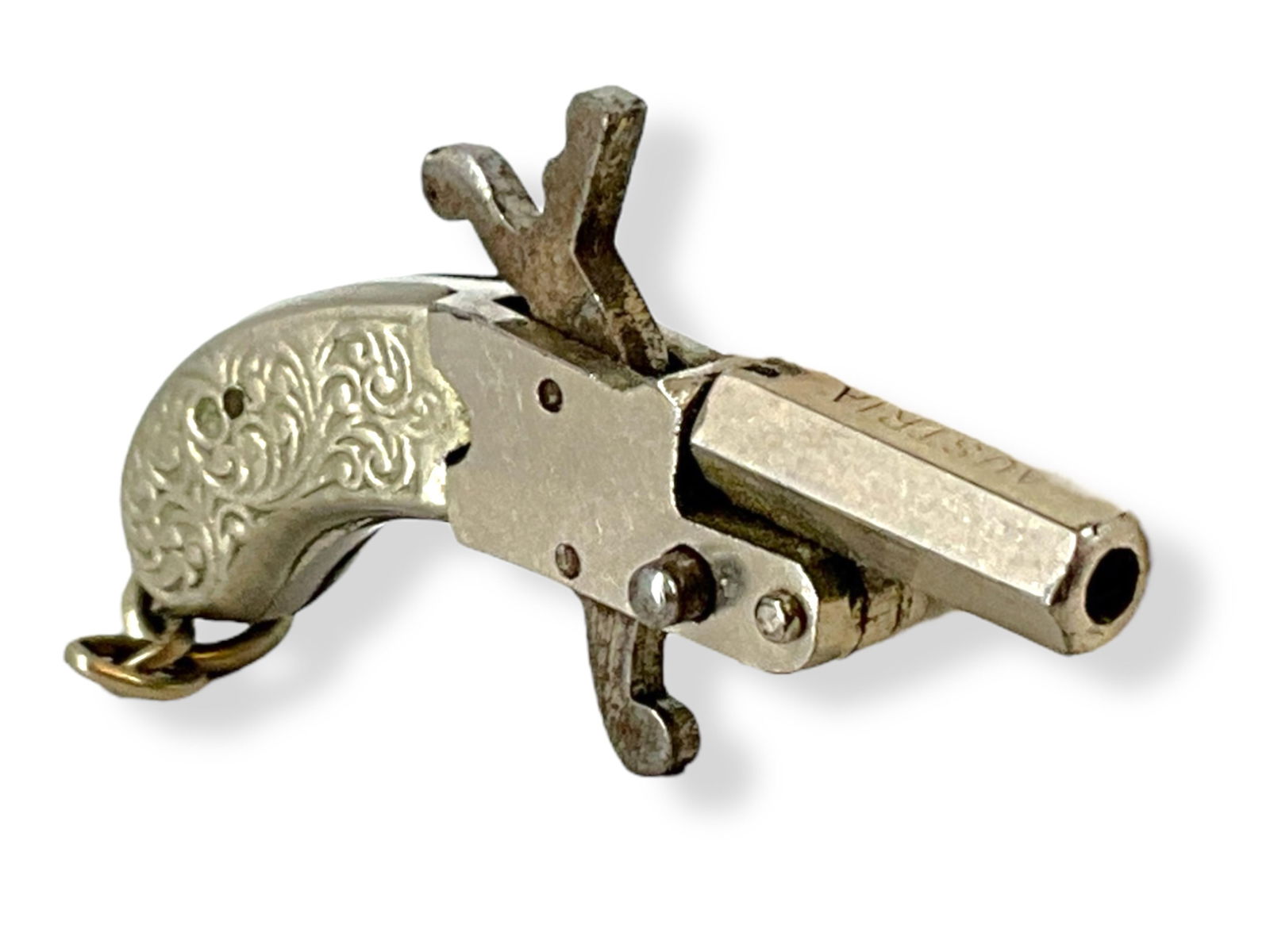 Tiny Antique Pinfire Cap Gun Pistol Fob/Charm from Austria: Tiny Antique Pinfire Cap Gun Pistol Fob/Charm from AustriaMade primarily of tested nickel, this tiny (approx 1 1/2î long) pinfire cap gun pistol fob/charm is stamped ìAustriaî - the little fob has