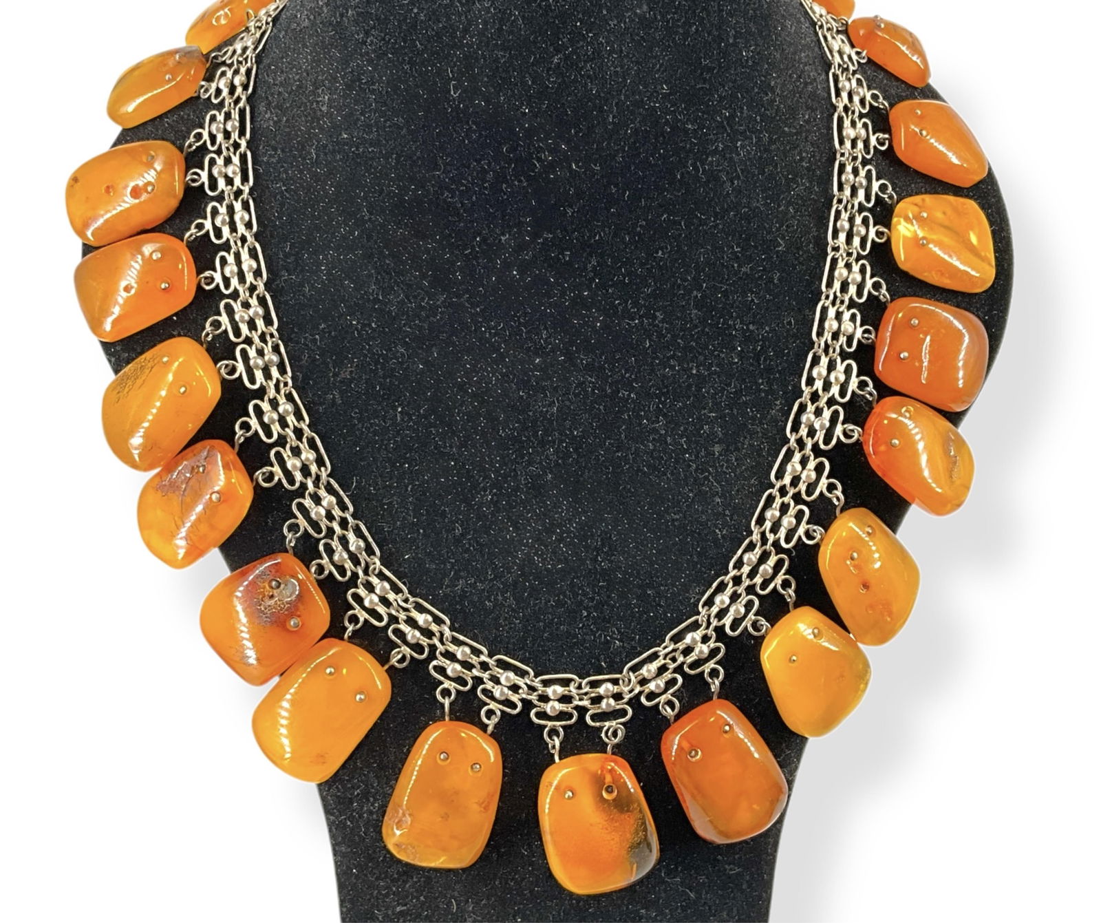 Striking Bib Necklace w/Amber Drops: Striking Bib Necklace w/Amber DropsFantastic bib necklace has a chain made up of tested copper, palladium, silver and rhodium that has 23 drops of approx 1 1/4î long amber which show natural imperfec