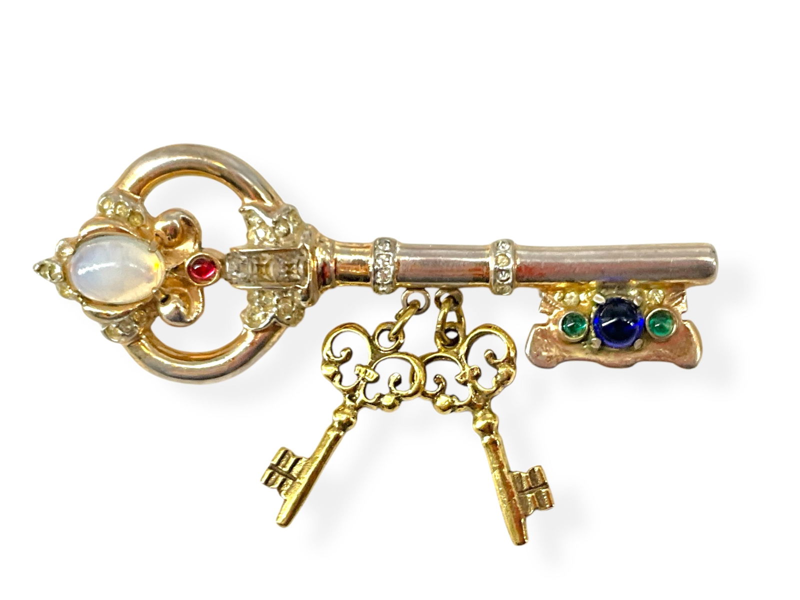 Adorable Vintage Skeleton Key Pin from ìCoro Craft Sterlingî: Adorable Vintage Skeleton Key Pin from ìCoro Craft SterlingîSkeleton key pin is hallmarked ìCoro Craft Sterlingî and tests primarily silver with a gold overlay, key has green, blue, red and opales