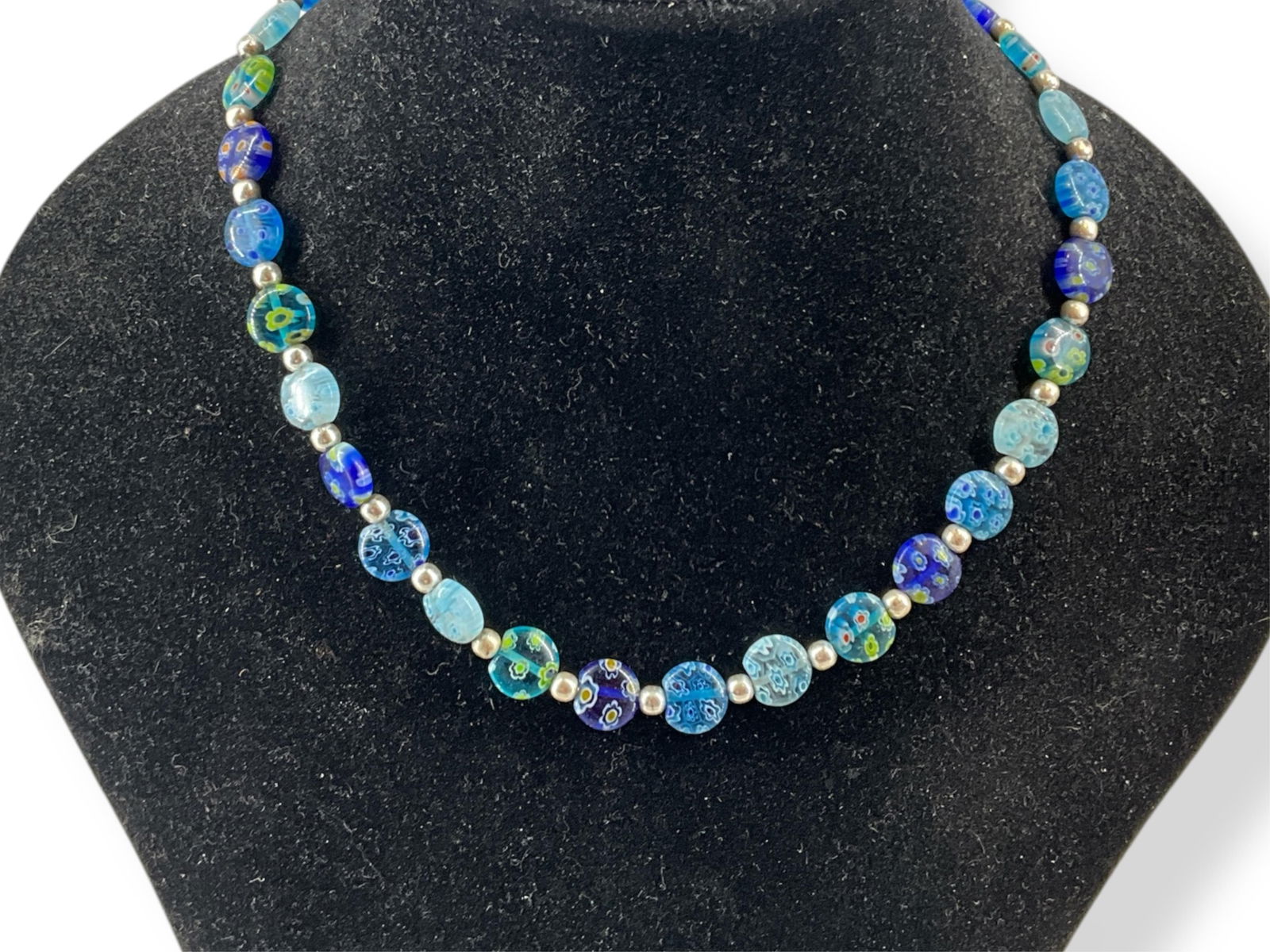 Pretty Silver & Blue Murano-Type Glass Necklace: Pretty Silver & Blue Murano-Type Glass NecklaceNecklace is an 18" adjustable length and features circular, flat-shaped art-glass beads with fancy designs, almost like paperweights. The necklace has a
