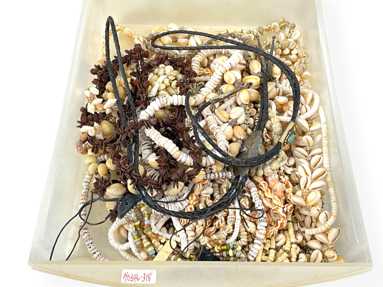 Tray Full of Shell Necklaces, a Vintage Silver Turquoise Bolo and Vintage Silver Lapis-Lazuli Bolo: Tray Full of Shell Necklaces, a Vintage Silver Turquoise Bolo and Vintage Silver Lapis-Lazuli Bolo Tie This lot contains multiple various types of shell necklaces in different lengths and sizes, one n