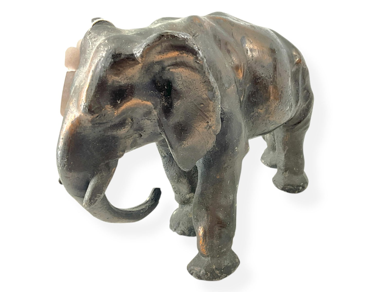 Heavy Vintage Elephant Door Stop: Heavy Vintage Elephant Door StopVintage doorstop is designed as a regal elephant, weighs approximately 11.6 lbs. (a consideration for shipping) and appears to have some copper in its composite. This b