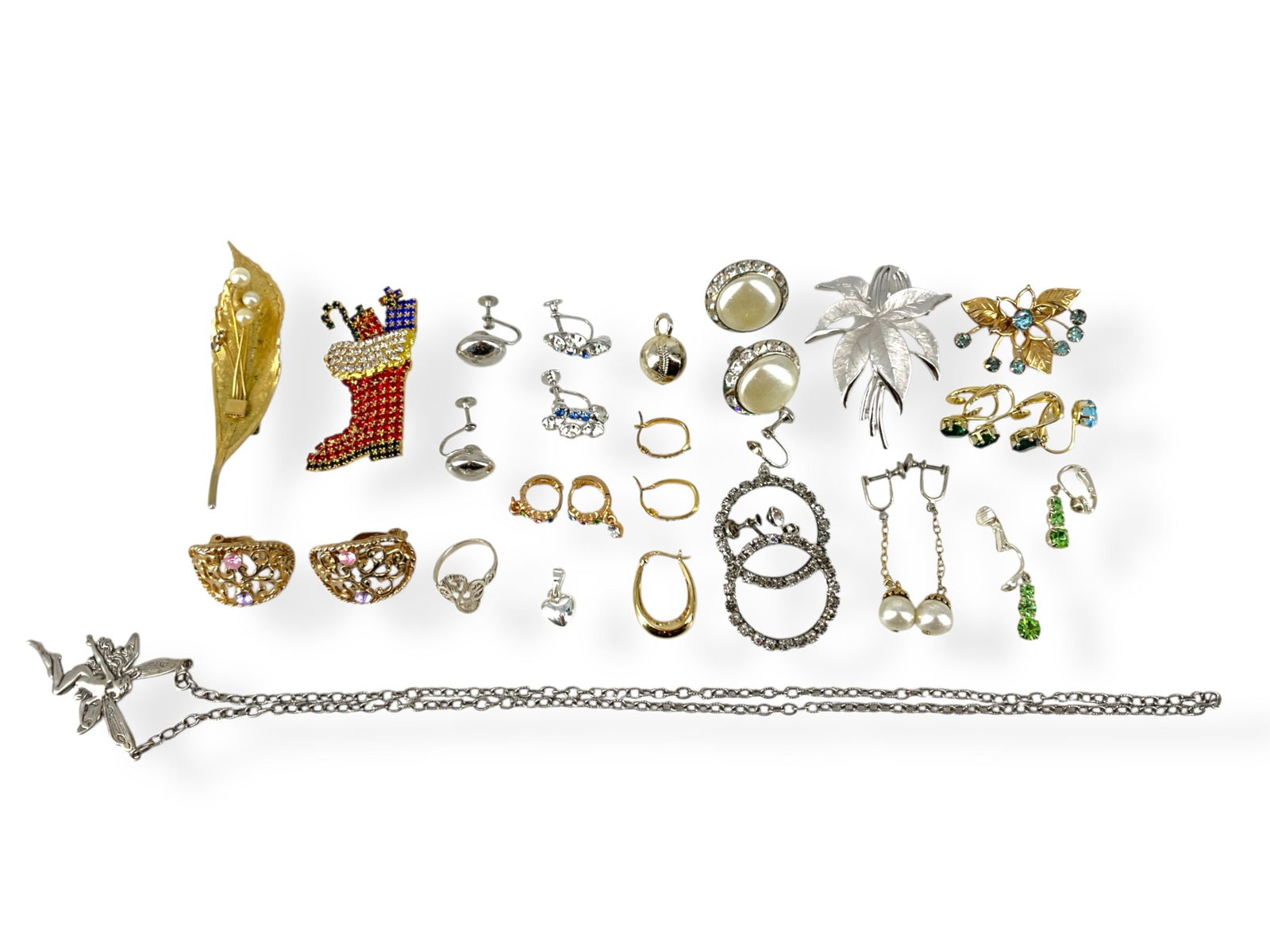 Vintage Fashion Jewelry Including Silver Fairy Necklace, Silver Lacy Ring, Christmas Pin and More: Vintage Fashion Jewelry Including Silver Fairy Necklace, Silver Lacy Ring, Christmas Pin and MoreLot has various pieces of vintage fashion jewelry including a signed "Trifari" silver-tone leaf brooch