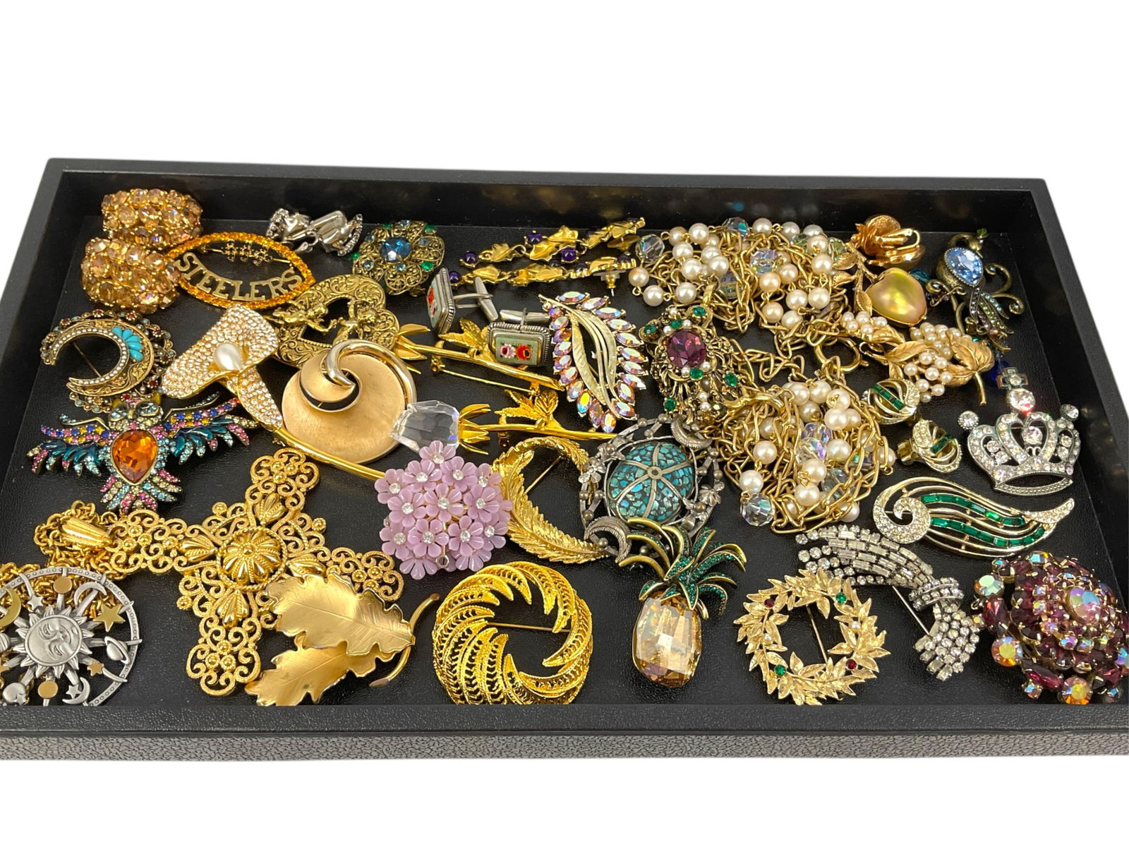 Assortment of Fashion Jewelry & Accessories: Assortment of Fashion Jewelry & AccessoriesCiner crystal earrings, modern owl pin with crystals, openwork cross pendant from Trifari on chain, Napier calla lily brooch with faux pearl, micromosaic cuf