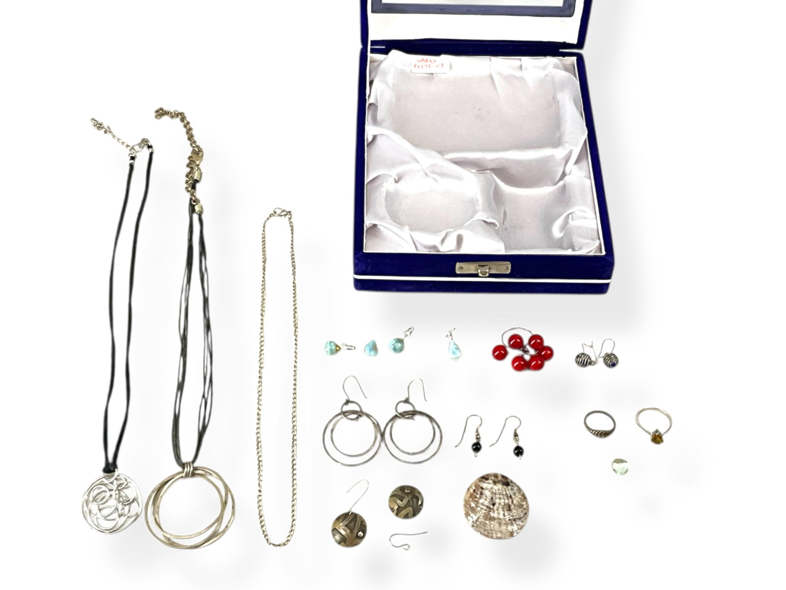 Blue Velvet Box w/Jewelry Contents Including Silver Rings: Blue Velvet Box w/Jewelry Contents Including Silver RingsBox measures approx 6" wide, 2 1/2" tall and 7 1/4" deep, has navy blue velvet covering, a center transparent plastic window, a silver-tone fol