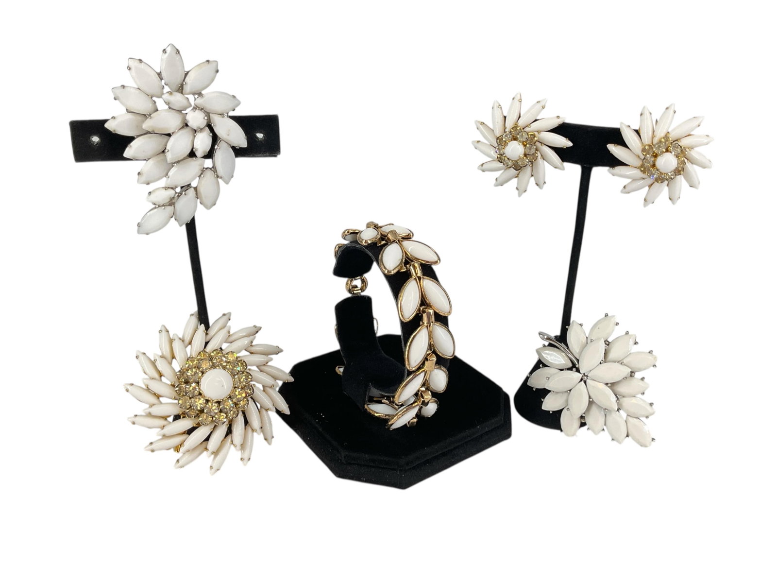 Vintage Milk Glass Jewelry Hallmarked by Judy Lee and Trifari Crown: Vintage Milk Glass Jewelry Hallmarked by Judy Lee and Trifari CrownLot includes a pair of clip-back earrings in a tiered swirl design with milk-glass and diamantÈ stone decoration @ 1 1/4" wide havin