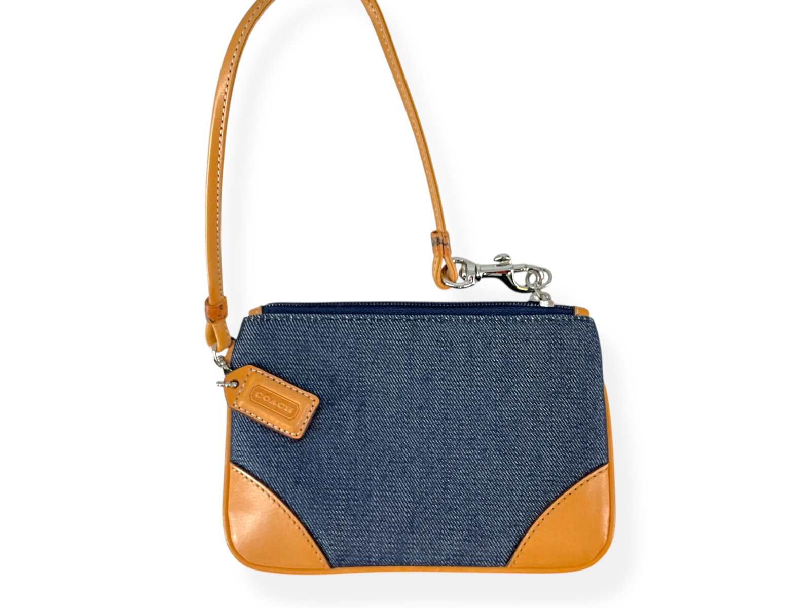 Little Denim Wristlet w/Tan Leather Trim by COACH: Little Denim Wristlet w/Tan Leather Trim by COACH Denim wristlet has a zipper closure, silver-tone hardware, tan leather trim, measures approx 6" wide x 4" tall, strap has a metal dog-leash clip and h