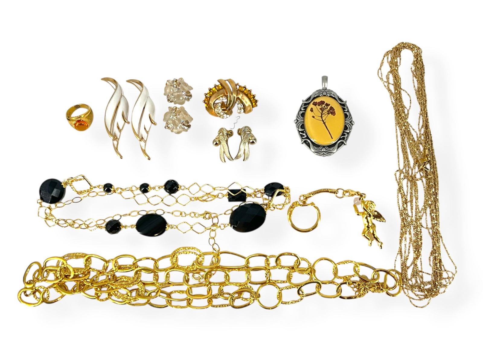 Gold-Tone Fashion Chains, Trifari Crown Brooches, Vintage Monet Earrings, Signed "Vendome" Fashion: Gold-Tone Fashion Chains, Trifari Crown Brooches, Vintage Monet Earrings, Signed "Vendome" Fashion Earrings and MoreGold-tone fashion chains include one tagged "Bellezza," there is a gold-tone angel k