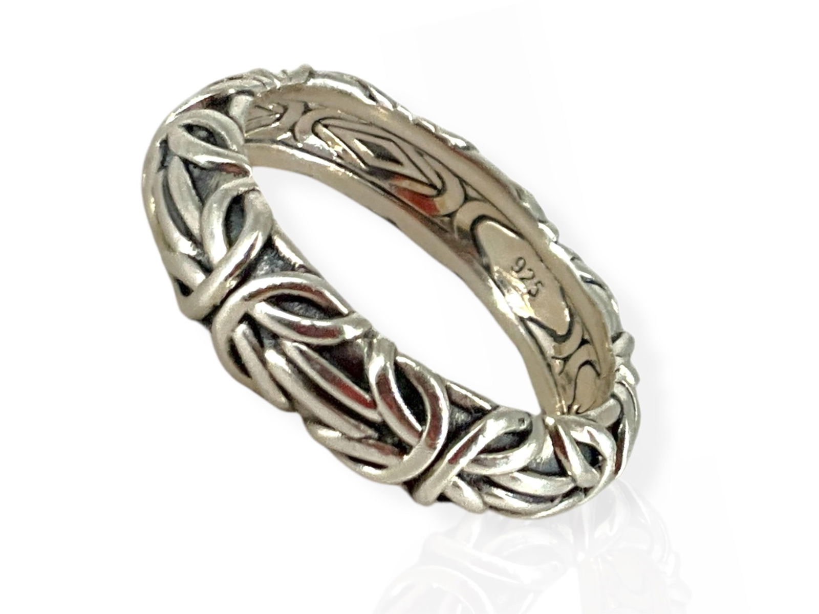 Sterling Silver Ring from Jai: Sterling Silver Ring from Jai0.125 troy ounces total weight, polished metal finish, straight shank design, signed Jai, modern design, size 6, stamped and tested sterling silver/925.