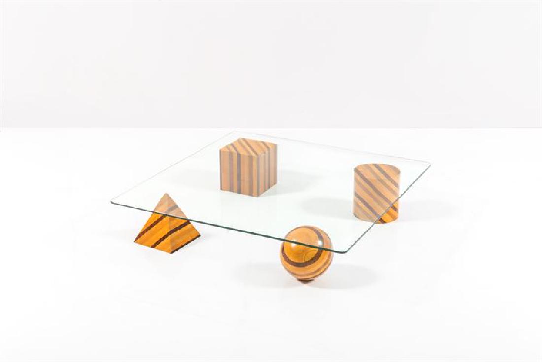 VIGNELLI MASSIMO_x000D_ Tavolino mod. Metafora: Basi geometriche in legni diversi, piano in vetro trasparente.Prod. Casigliani 1979cm 22,5x120x120Bibl.: Giuliana Gramigna, "Repertorio del Design Italiano1950-2000", Allemandi, 2011, pag. 266