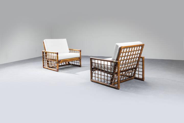 PRODUZIONE ITALIANA: Pair of armchairs with bamboo structure, leather bindings, brass details, cushions covered in fabric. From the 1960s cm 80x84x76