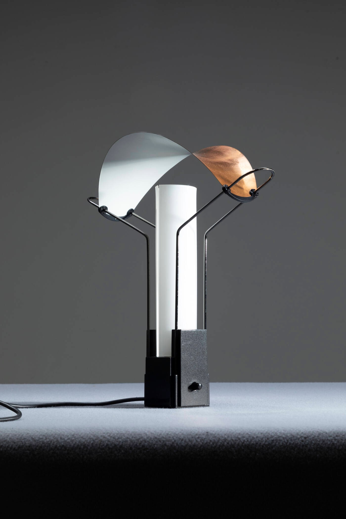MIRANDA SANTIAGO PERRY KING: MIRANDA SANTIAGO PERRY KING Table lamp mod. Palio Lacquered metal and opaline glass. Manufacturer's mark Made by Arteluce, 1980s h cm 40x35