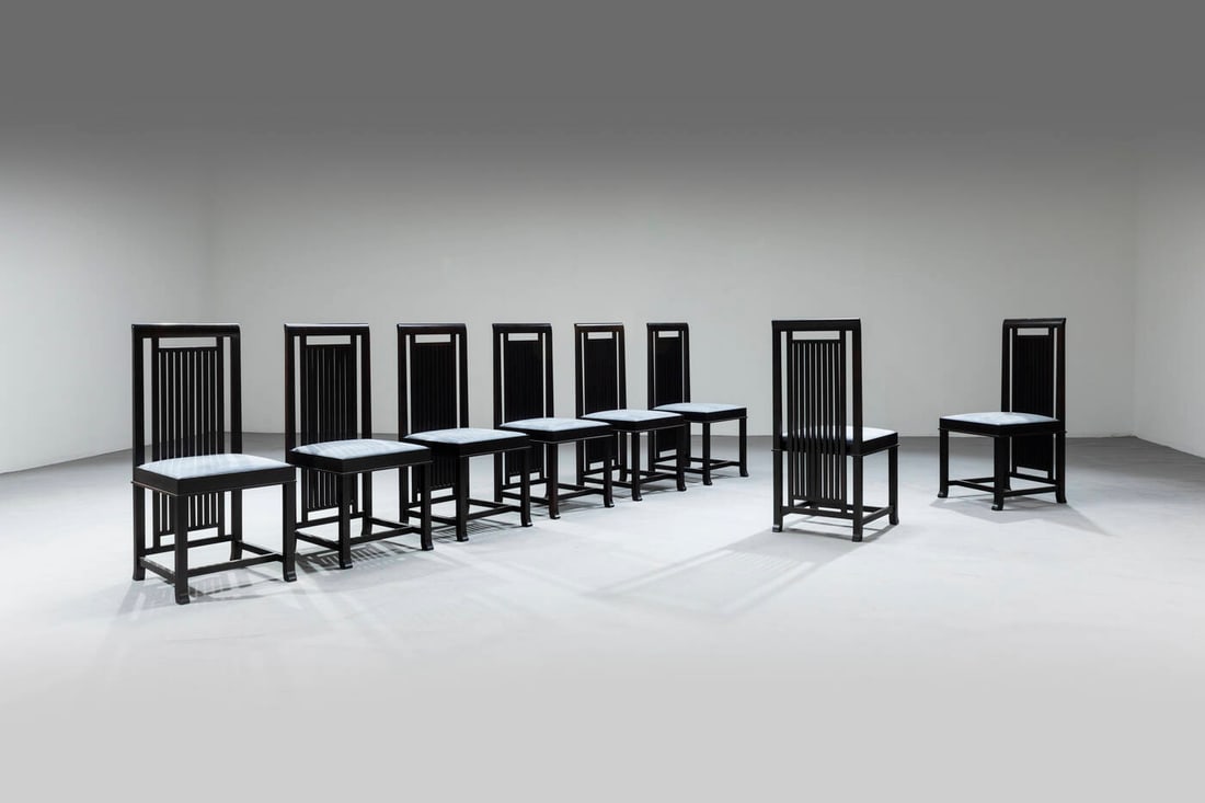 FRANK LLOYD WRIGHT: FRANK LLOYD WRIGHTOtto sedie mod. 614Struttura in legno laccato, imbottitura rivestita in tessuto. Marchio del produttoreProd. Cassina, 1992cm 94x42x47,5Bibl.: C. Fiell & P. Fiell, "1000 chairs" Tasch