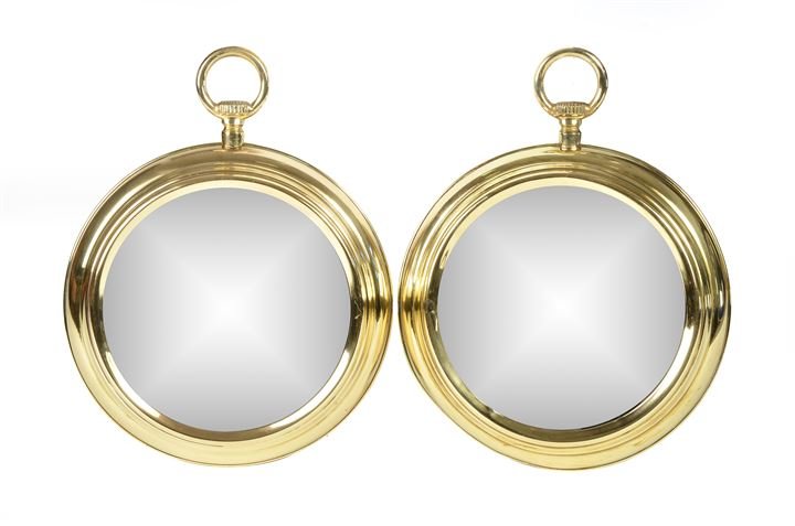 FORNASETTI PIERO (nello stile di) Coppia di specchi da: parete in cristallo specchiato e cornice in ottone. Anni '60 diam cm 50