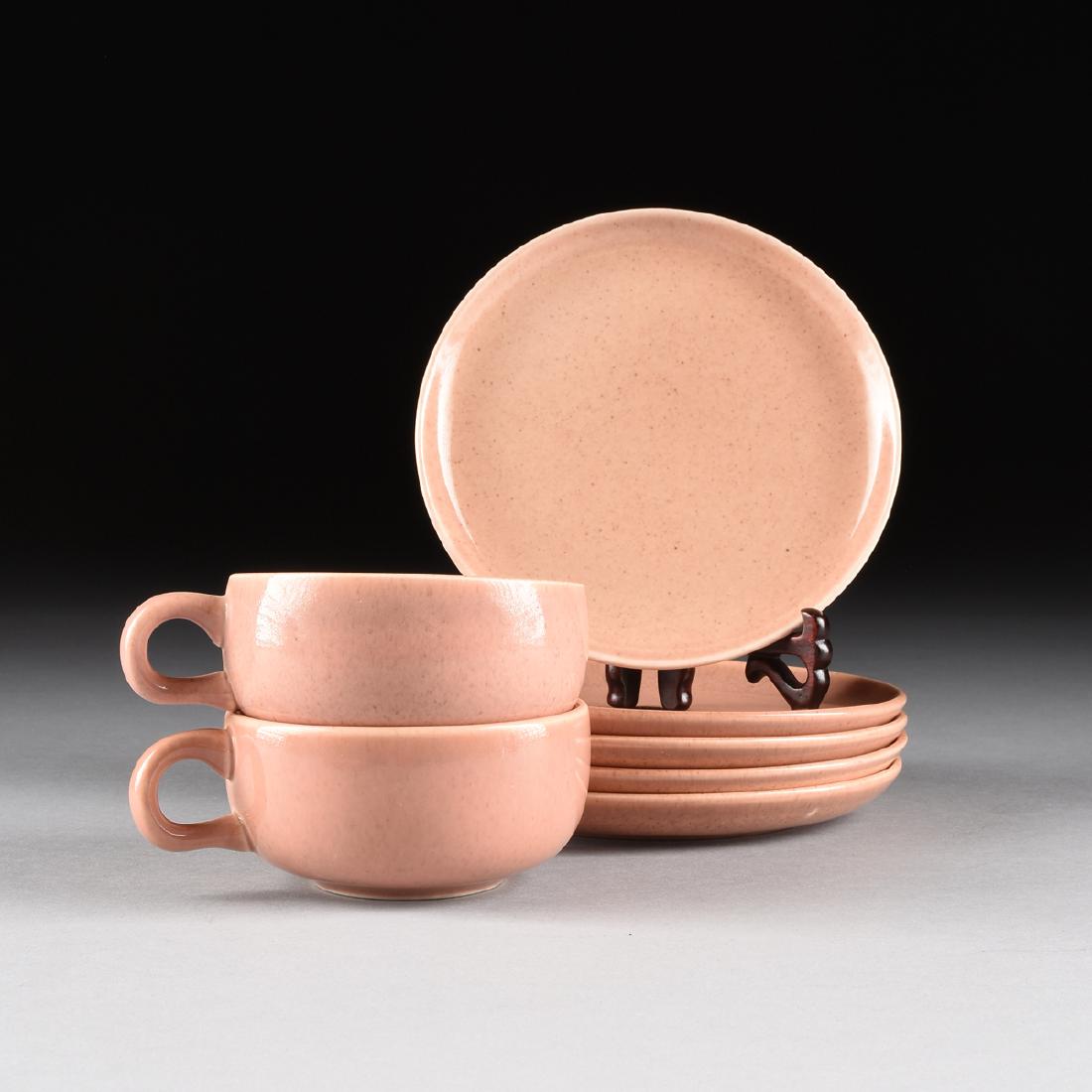 A GROUP OF SEVEN PIECES OF RUSSEL WRIGHT (American,: A GROUP OF SEVEN PIECES OF RUSSEL WRIGHT (American, 1904-1976) CORAL GLAZED "AMERICAN MODERN" DINNERWARE, FOR STEUBENVILLE POTTERY CO., STEUBENVILLE, OHIO, DESIGNED 1939, comprising two flat tea cups,
