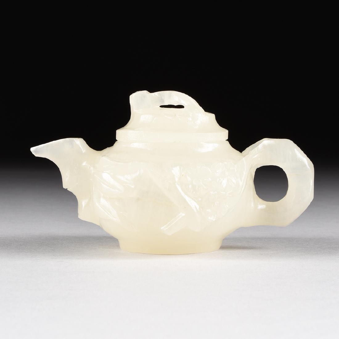 A CHINESE CARVED WHITE MUTTON FAT JADE TEAPOT WITH (1 of 8)