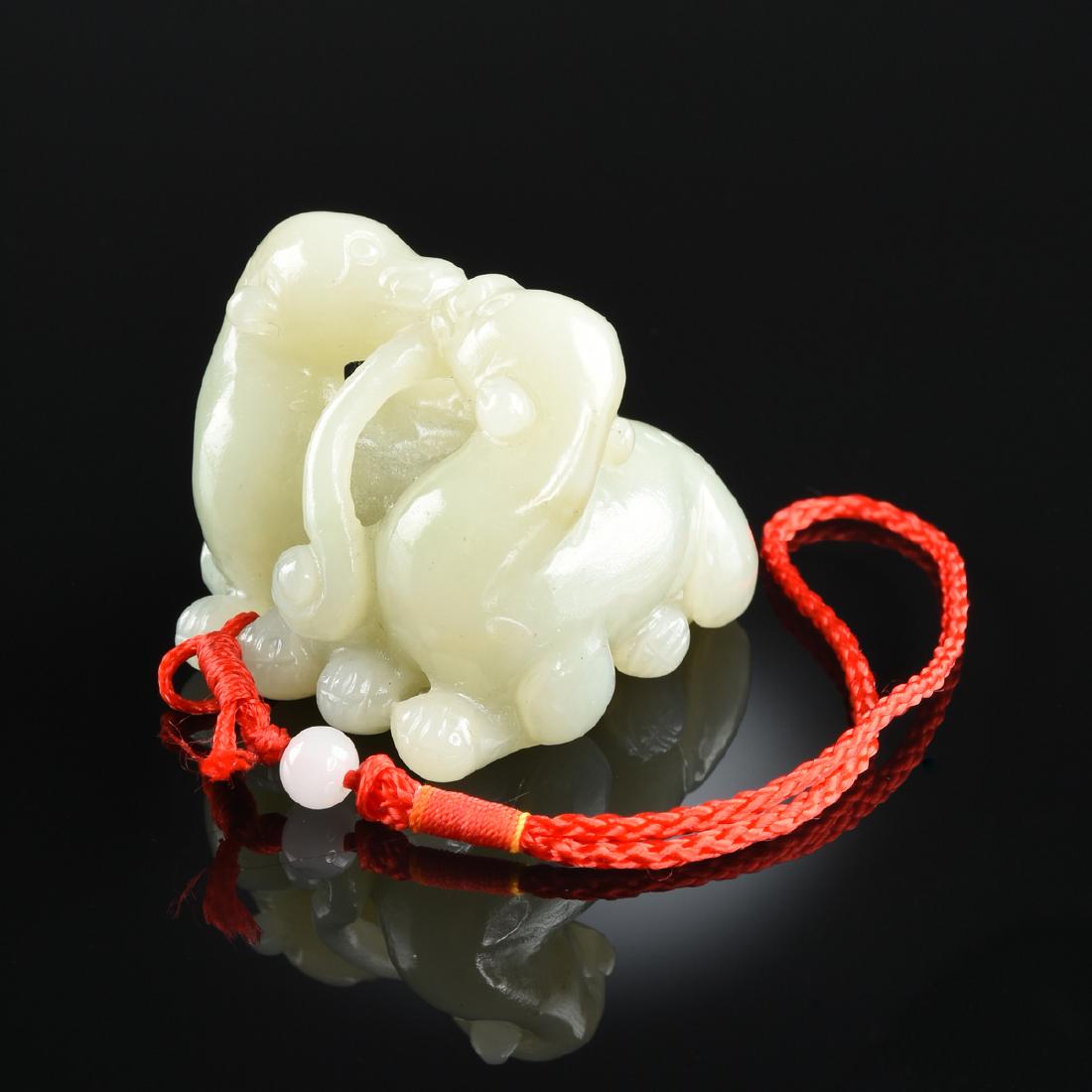 A CHINESE CARVED JADE FIGURAL PENDANT, 20TH CENTURY, (1 of 4)