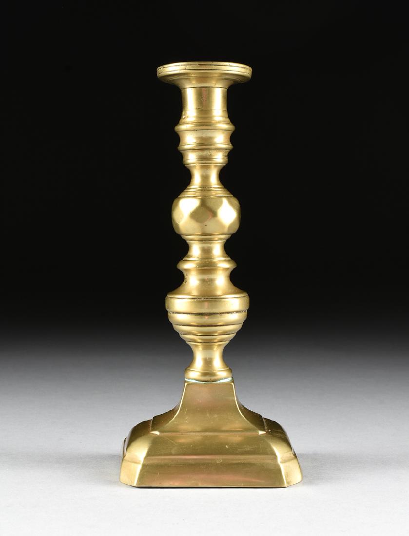 A CAST BRASS CANDLESTICK, PROBABLY AMERICA, CIRCA 1900, (1 of 7)