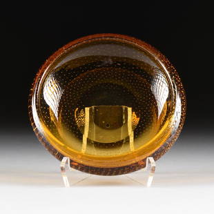 AN AMBER GLASS BOWL WITH CONTROLLED BUBBLE DECORATION,: AN AMBER GLASS BOWL WITH CONTROLLED BUBBLE DECORATION, POSSIBLY WHITEFRIARS GLASS LTD., LONDON, ENGLAND, CIRCA 1960-1970, the low roll lipped amber bowl with swirled controlled bubble decoration. Heig